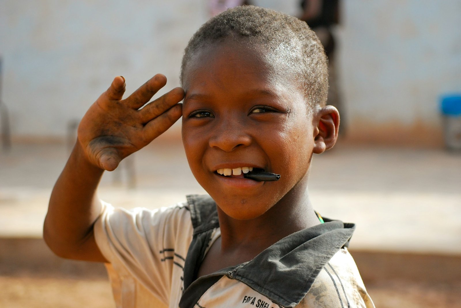Little african boy (streetchild) greeting - africa travel portrait child